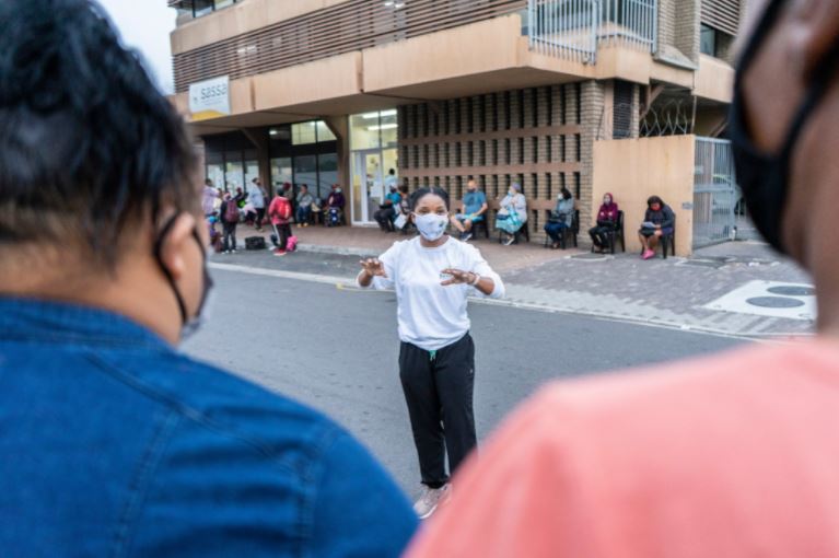 People gather outside SASSA office.