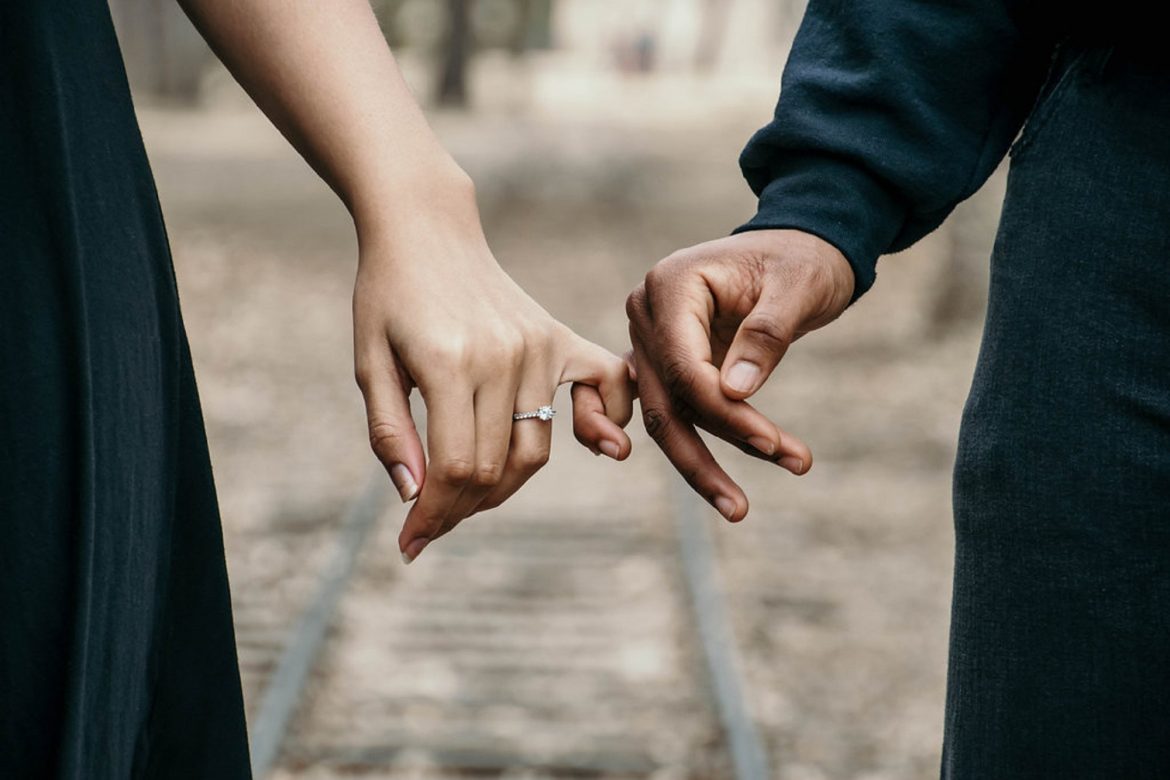 Couple holding hands