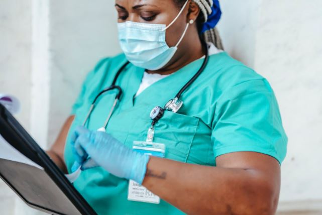 Nurse wearing a mask and gloves