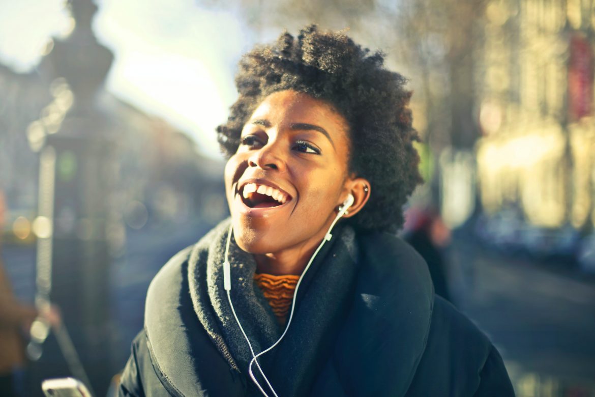Woman listening to music/ Pexels