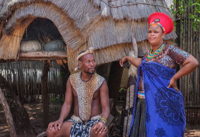 man and woman in traditional wear