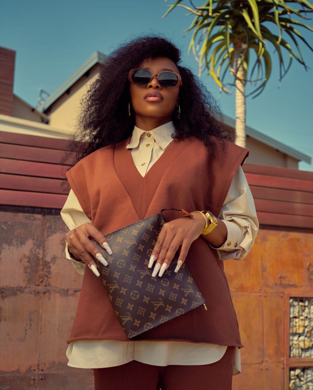 DJ Zinhle exposes her baby bump