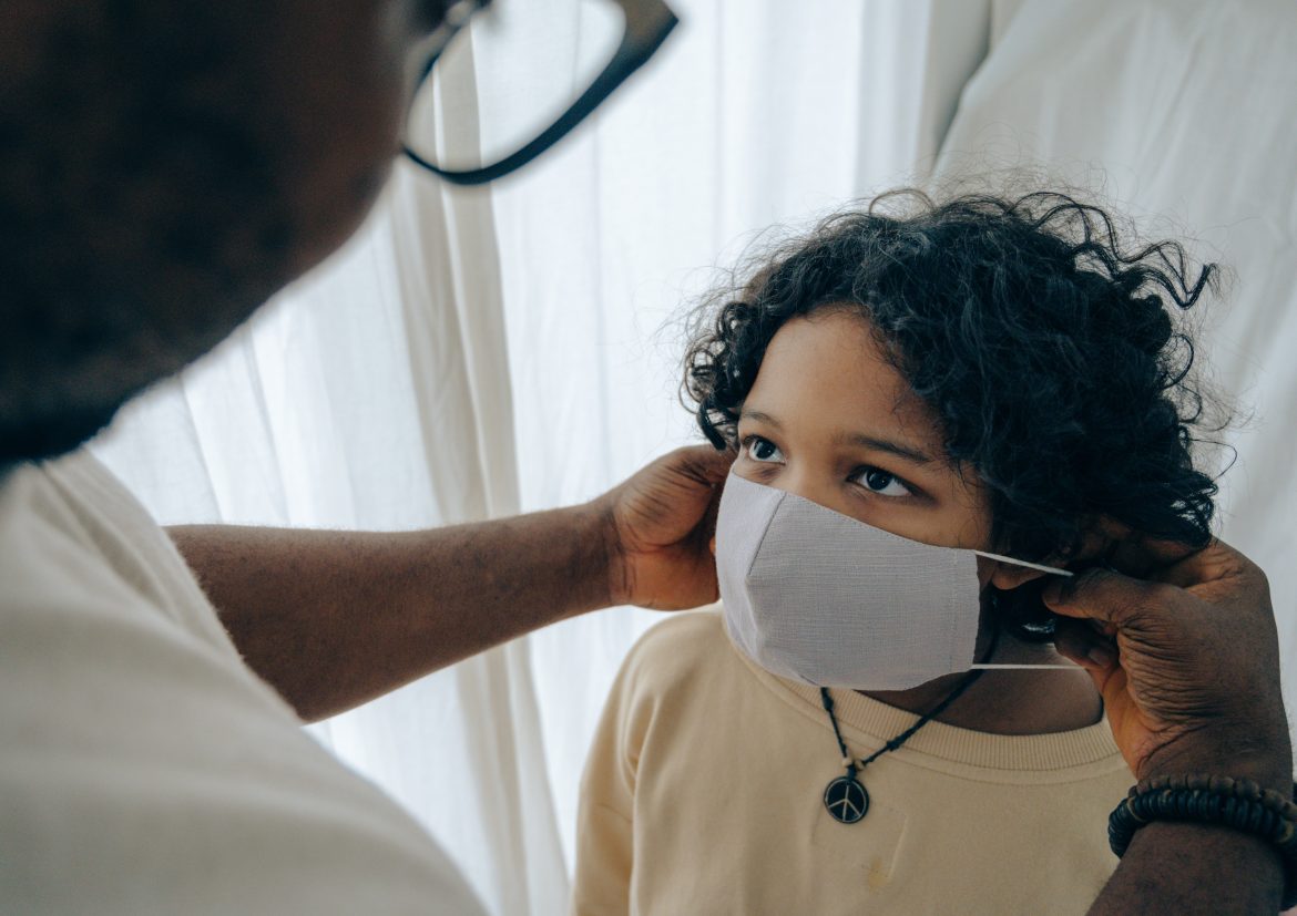 A child wearing a mask/ Pexels