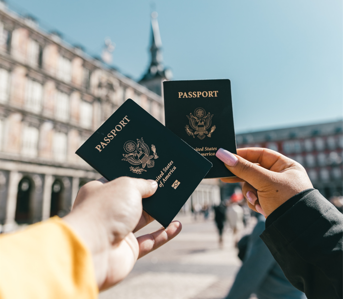 Women holding passports Pexels