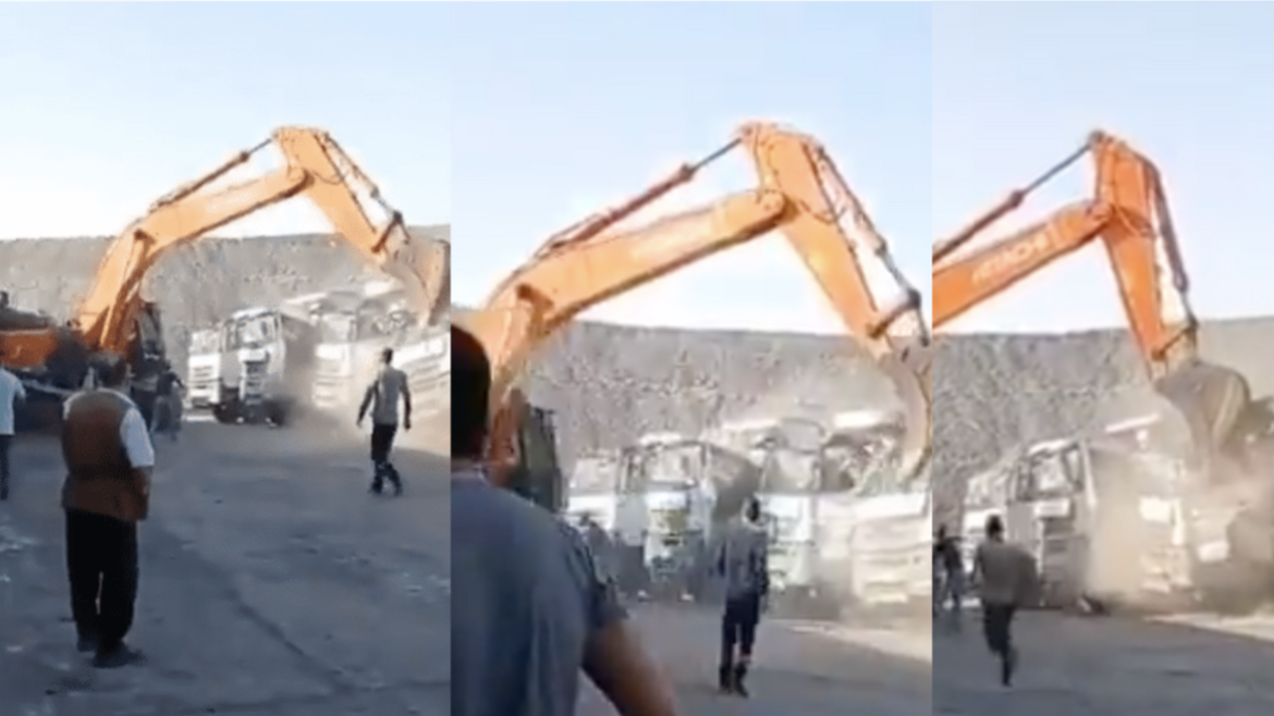 Man gets fired and jumps on a TLB to destroys a fleet of company trucks