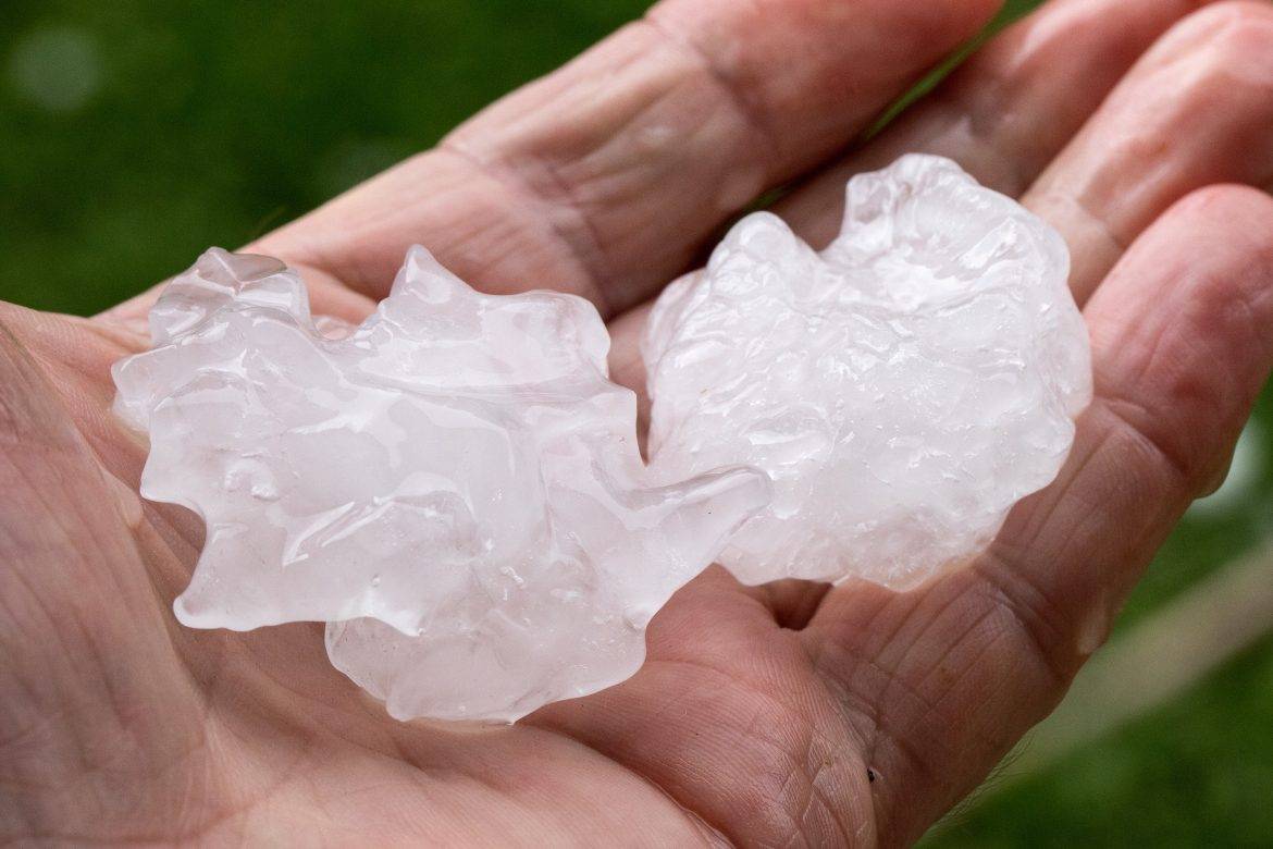 Hail stones held in hand after thunder storm
