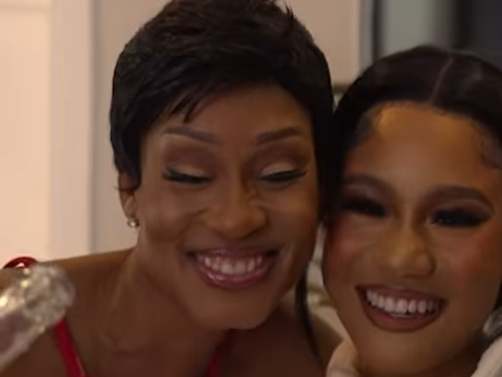 Kgomotso Christopher and her daughter Lehakwe embracing and smiling