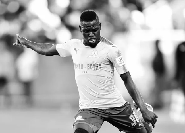 Siyabonga Zulu kicking a soccer ball