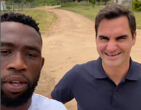 Siya Kolisi gives Roger Federer a tour of a South African village