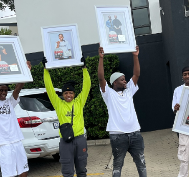 Biri Marung composers holding up double platinum plaques