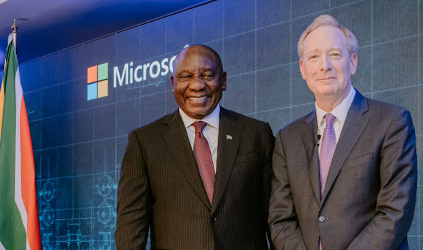 Cyril Ramaphosa shaking hands with Microsoft executive