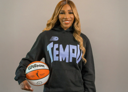 Serena Williams holding a basketball