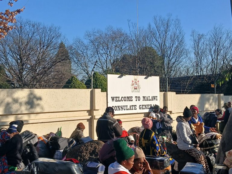 Scores of foreign nationals gather at embassies with hours to go before the 30 June deadline